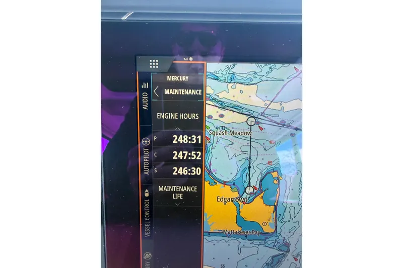 Slide: The Image of Navigation display on 2024 Axopar 45 XC Cross Cabin showing engine hours and map. - 47