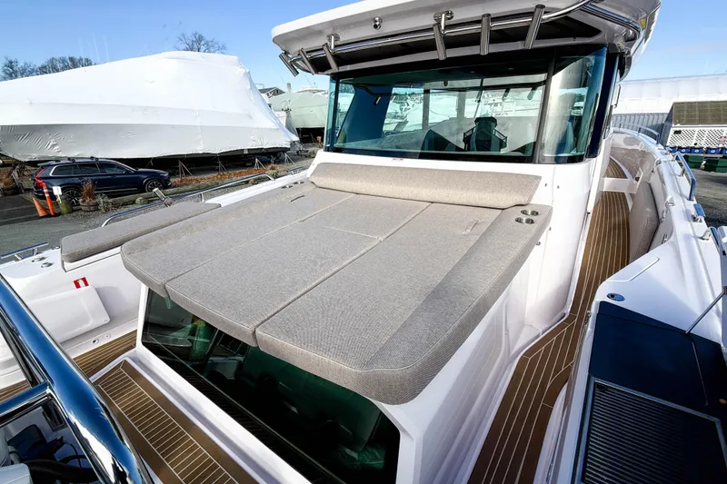 Slide: The Image of 2024 Axopar 45 XC Cross Cabin with spacious sun deck and modern design. - 5