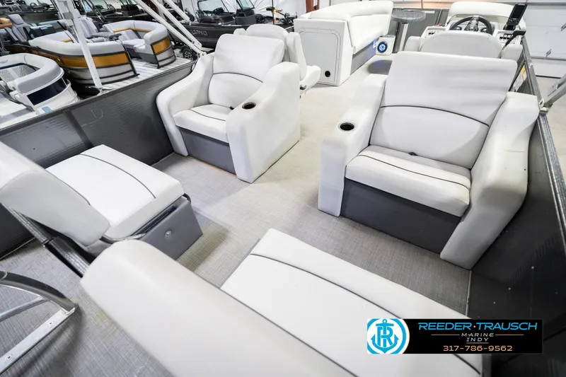 Slide: The Image of Interior of 2021 Crest SLRC 220 boat with white seating and cup holders. - 13