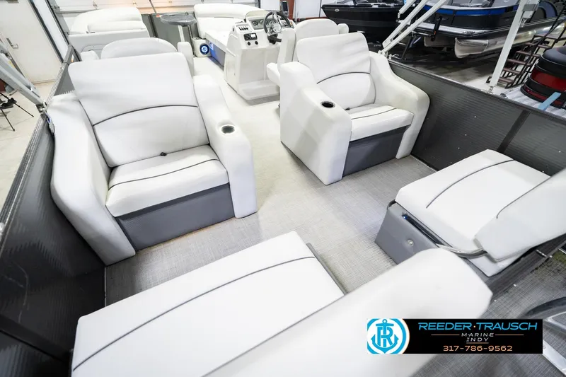 Slide: The Image of Interior of a 2021 Crest SLRC 220 boat with white seating and modern design. - 14