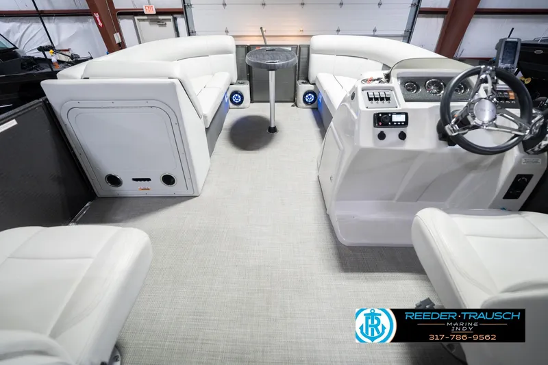 Slide: The Image of Interior of a 2021 Crest SLRC 220 boat with modern seating and control panel. - 19