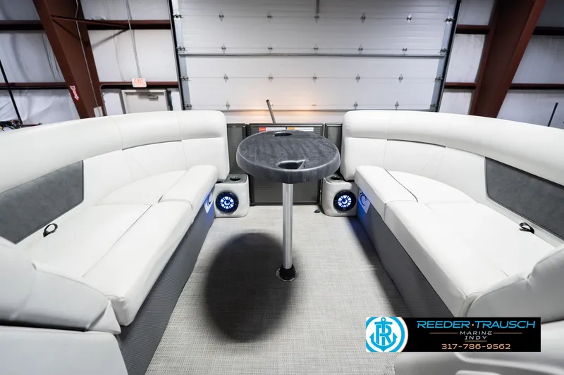 Slide: The Image of Interior of 2021 Crest SLRC 220 pontoon boat with plush seating and table. - 20
