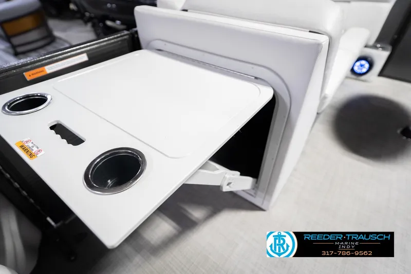 Slide: The Image of Crest SLRC 220 boat interior with foldable table and cup holders, 2021 model. - 26
