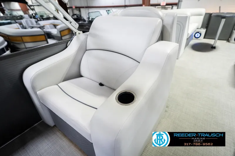 Slide: The Image of Luxury white seating on 2021 Crest SLRC 220 boat with cup holder, showroom display. - 29
