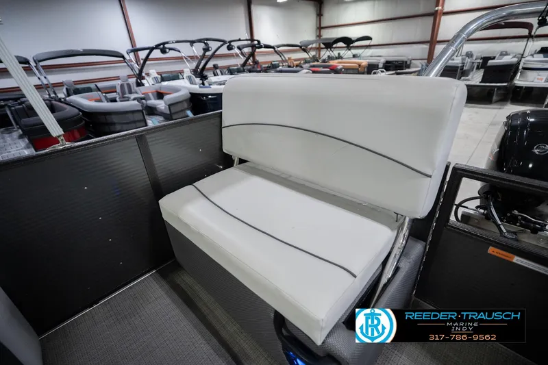 Slide: The Image of Crest SLRC 220 boat interior with white seating, 2021 model, in showroom. - 32