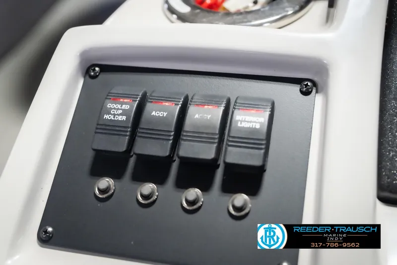 Slide: The Image of Control panel of 2021 Crest SLRC 220 boat with switches for accessories and lights. - 39