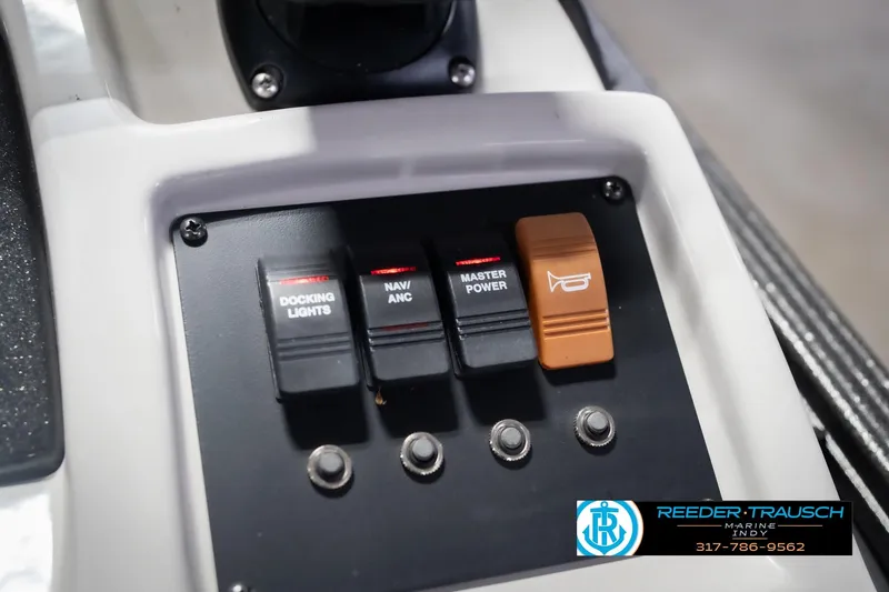 Slide: The Image of Control panel of a 2021 Crest SLRC 220 boat with labeled switches. - 42