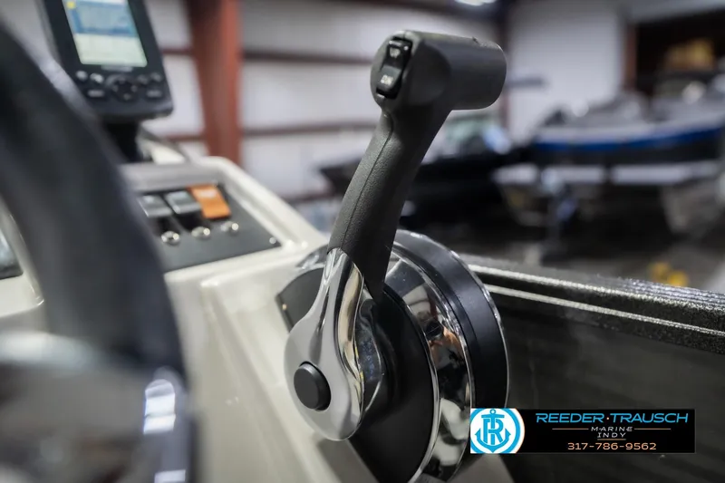 Slide: The Image of Close-up of 2021 Crest SLRC 220 boat throttle control in a showroom. - 43