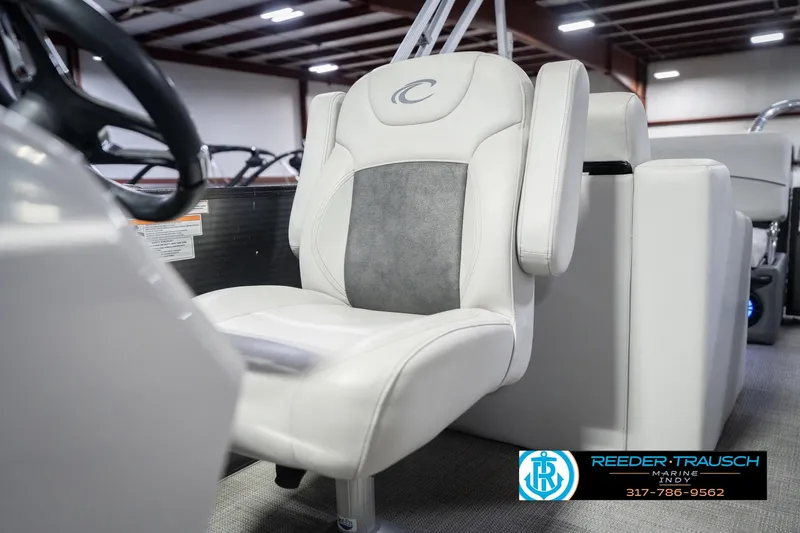 Slide: The Image of 2021 Crest SLRC 220 boat seat in showroom with Reeder-Trausch Marine logo. - 44