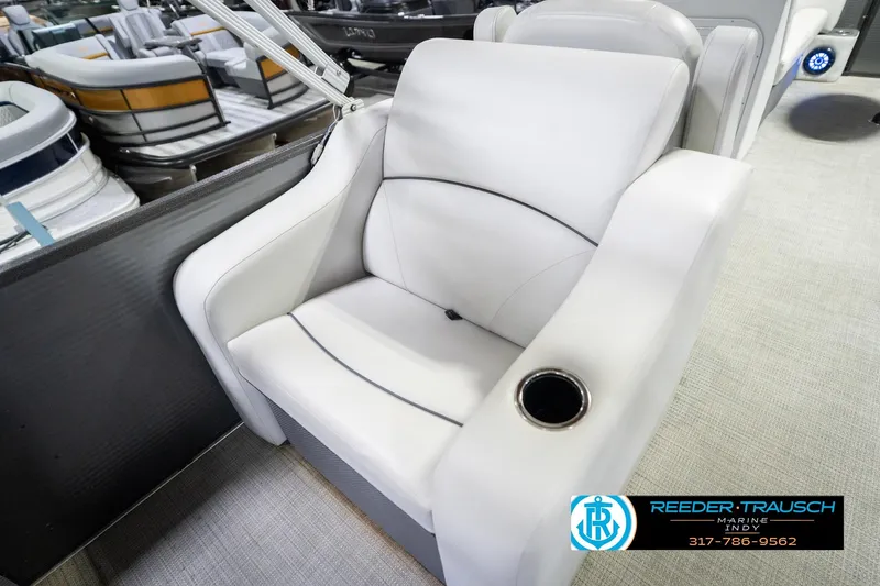 Slide: The Image of Luxurious white seat on Crest SLRC 220 boat, featuring a built-in cup holder. - 47