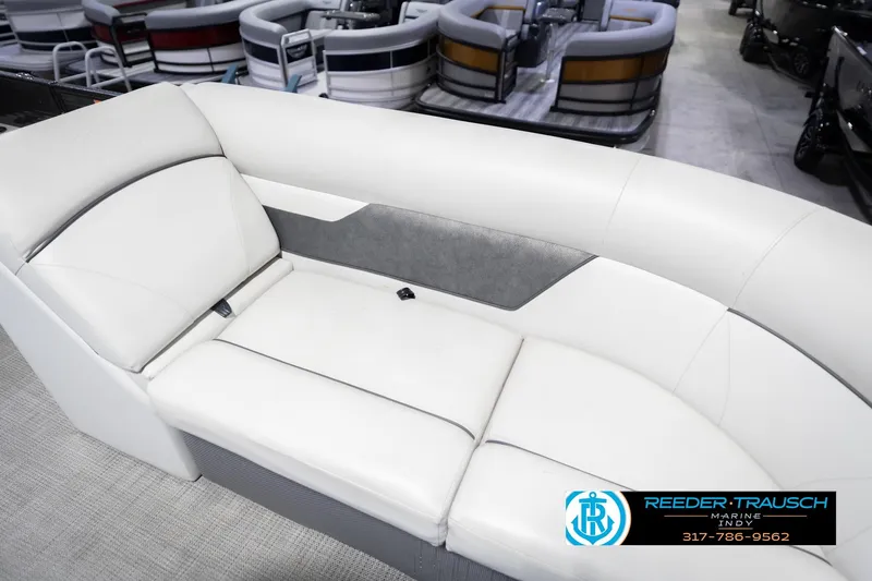 Slide: The Image of 2021 Crest SLRC 220 boat interior with white cushioned seating. - 49