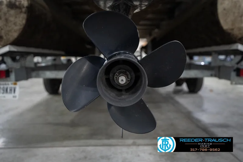 Slide: The Image of Close-up of a 2021 Crest SLRC 220 boat propeller in a garage setting. - 57
