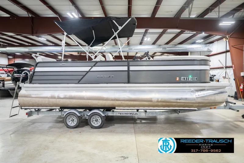 Slide: The Image of 2021 Crest SLRC 220 pontoon boat on trailer in indoor showroom. - 6