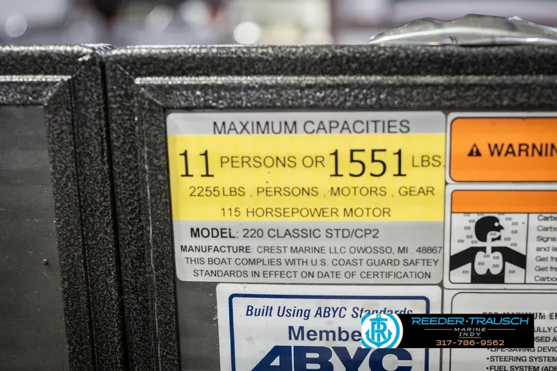 Slide: The Image of Crest SLRC 220 boat capacity label, 11 persons or 1551 lbs, 115 horsepower motor. - 64