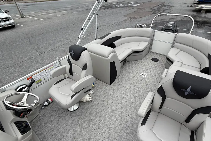 Slide: The Image of 2025 Berkshire 22RFX LE 2.75 pontoon boat interior with plush seating and steering console. - 10