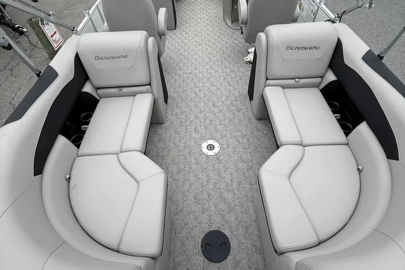 Slide: The Image of 2025 Berkshire 22RFX LE 2.75 boat interior with gray seating and carpeted floor. - 11