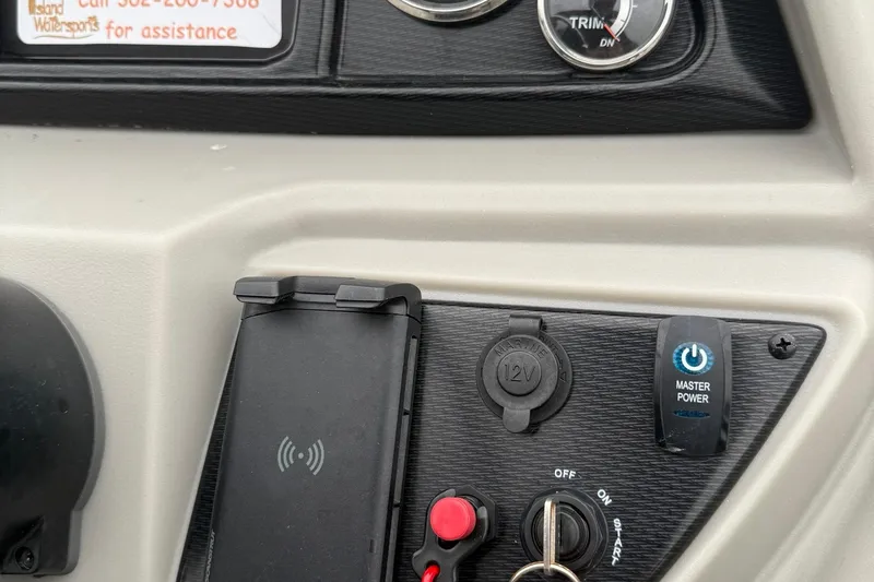 Slide: The Image of Control panel of 2025 Berkshire 22RFX LE 2.75 with power switch and 12V outlet. - 15