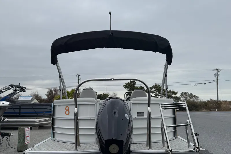 Slide: The Image of 2025 Berkshire 22RFX LE 2.75 pontoon boat with canopy, rear view in parking lot. - 7