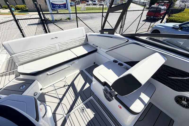 Slide: The Image of 2026 Sea Ray SPX 210 boat interior with white seating and modern design. - 10