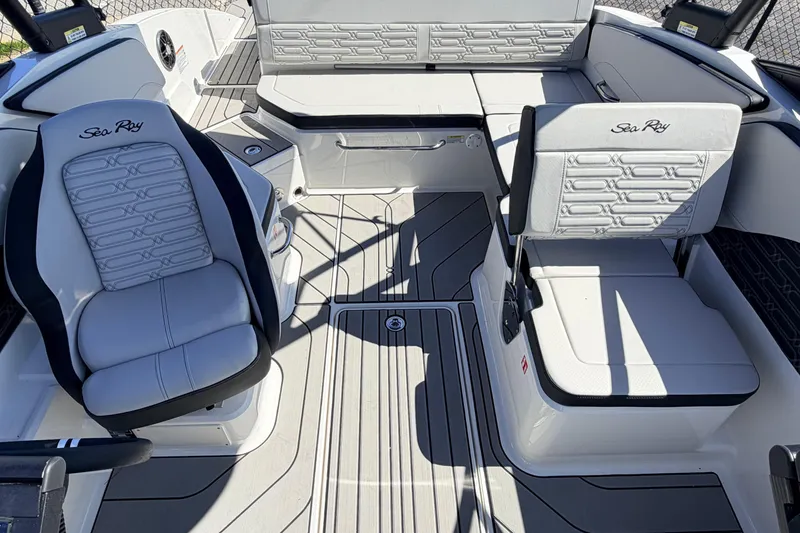 Slide: The Image of Interior of 2026 Sea Ray SPX 210 boat with stylish seating and modern design. - 11
