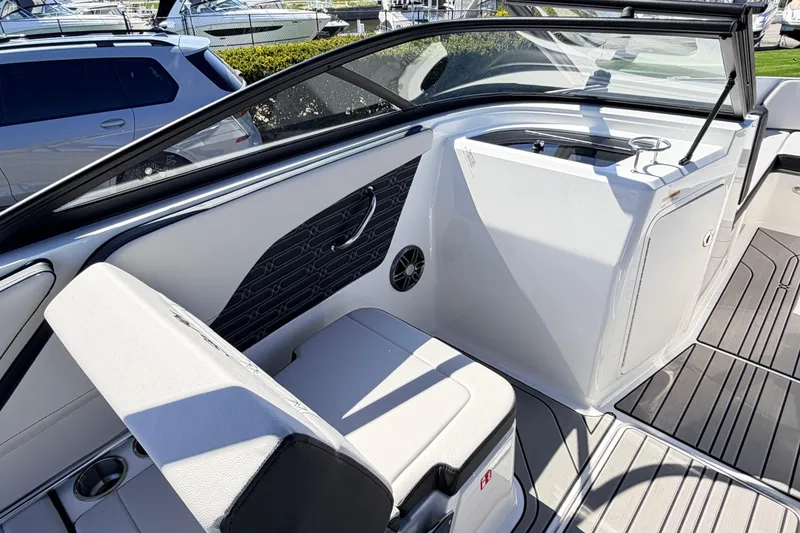 Slide: The Image of Interior view of 2026 Sea Ray SPX 210 boat, featuring sleek seating and modern design elements. - 13