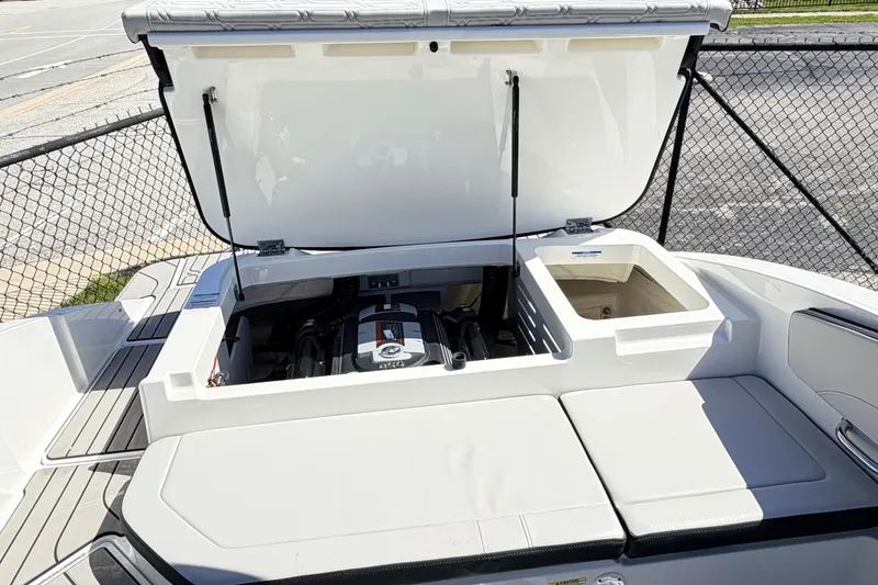 Slide: The Image of 2026 Sea Ray SPX 210 boat engine compartment open, showcasing modern design and functionality. - 14
