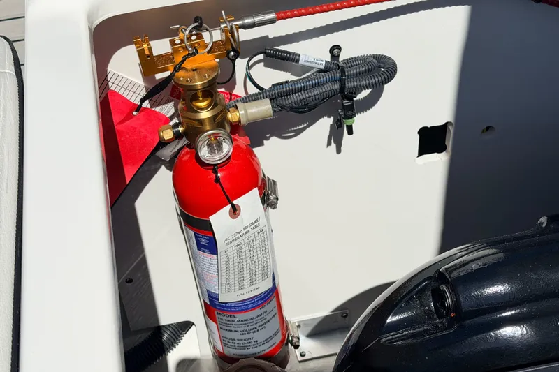 Slide: The Image of Fire extinguisher in 2026 Sea Ray SPX 210 boat compartment. - 17