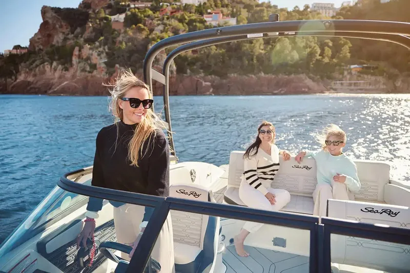 Slide: The Image of Man on 2026 Sea Ray SPX 210 boat, handling rope on sunny day. - 6