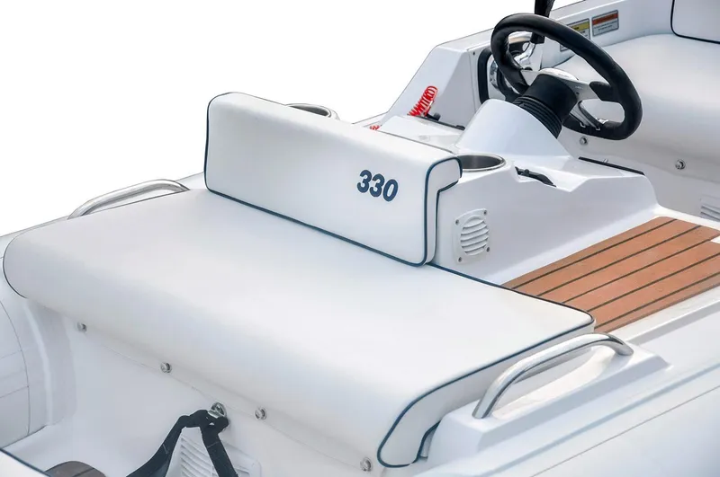 Slide: The Image of 2026 AB Inflatables ABJET 330 boat interior with steering wheel and control panel. - 3
