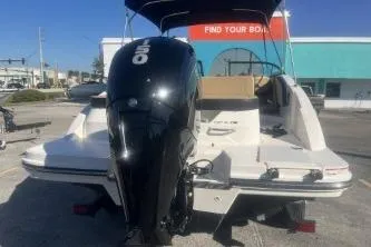 Slide: The Image of 2024 Sea Ray SPX 210 Outboard boat, rear view with powerful engine, parked outdoors. - 5