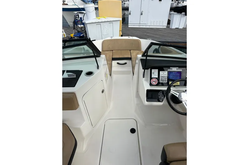 Slide: The Image of 2022 Sea Ray SPX 190 Outboard docked at a sunny marina with sailboats. - 12