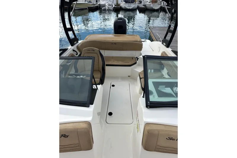 Slide: The Image of 2022 Sea Ray SPX 190 Outboard docked at marina under clear blue sky. - 13