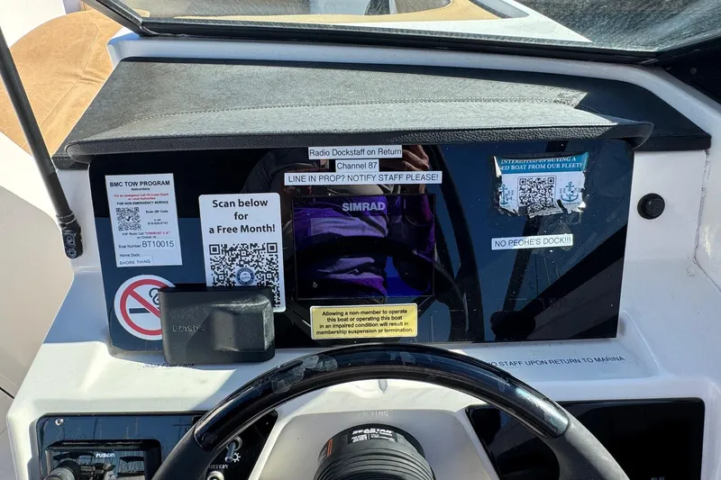 Slide: The Image of Dashboard of 2022 Sea Ray SPX 190 Outboard with QR codes and navigation equipment. - 30