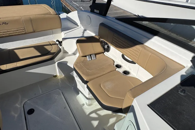 Slide: The Image of 2022 Sea Ray SPX 190 Outboard interior with tan seating and cup holders. - 31