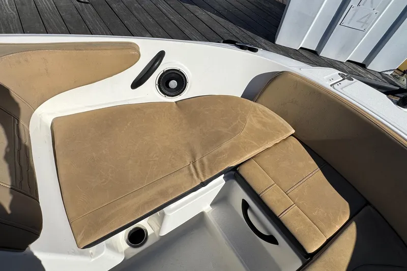 Slide: The Image of 2022 Sea Ray SPX 190 Outboard boat interior with tan seating and speaker. - 39
