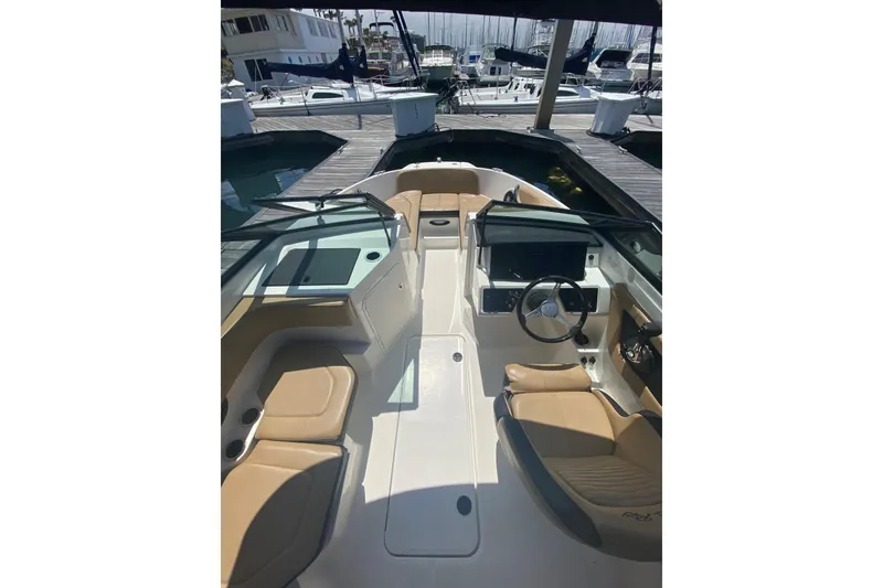 Slide: The Image of 2022 Sea Ray SPX 190 Outboard boat docked in a marina with sailboats. - 7
