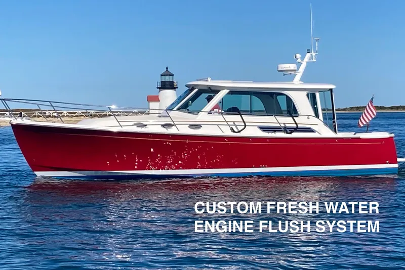 The Image of 2011 Back Cove 37 boat with custom fresh water engine flush system, near lighthouse. - 0