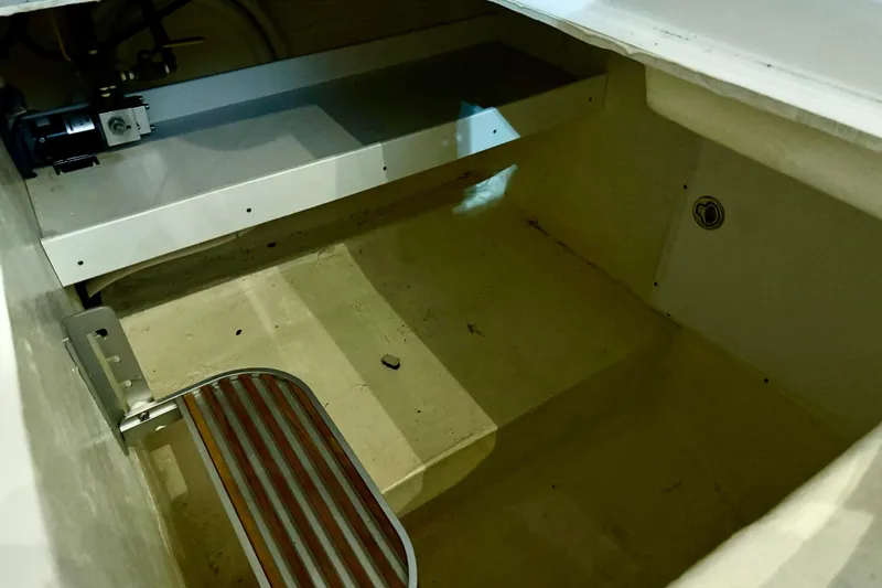Slide: The Image of 2011 Back Cove 37 boat interior with step and storage compartment. - 12