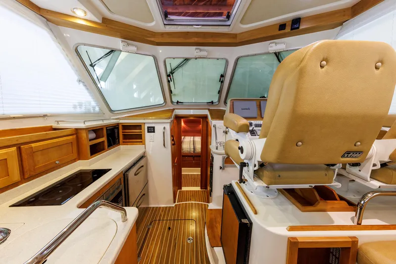 Slide: The Image of Luxurious interior of 2011 Back Cove 37 yacht with helm and galley area. - 36