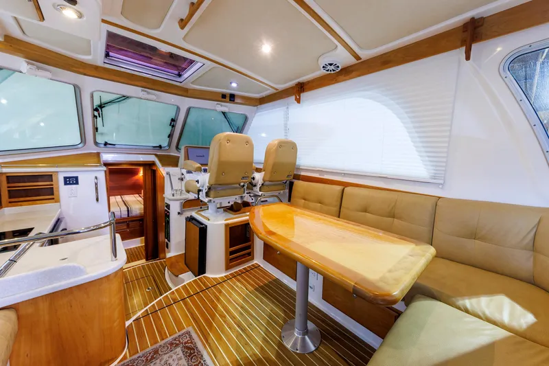 Slide: The Image of Luxurious interior of 2011 Back Cove 37 yacht with seating and helm station. - 39