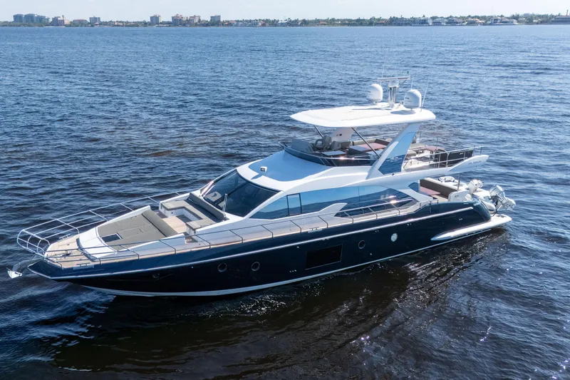 The Image of 2017 Azimut 66 Flybridge yacht cruising on open water. - 1