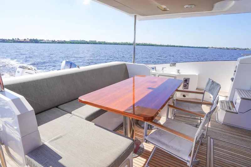 Slide: The Image of Luxurious 2017 Azimut 66 Flybridge yacht with elegant outdoor seating and ocean view. - 11