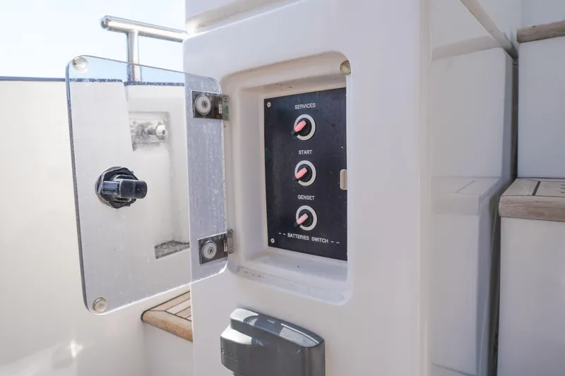 Slide: The Image of Control panel on 2017 Azimut 66 Flybridge yacht with switches for services, start, and genset. - 12