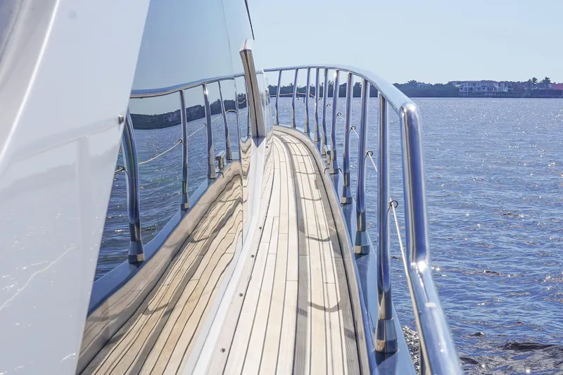 Slide: The Image of Side view of 2017 Azimut 66 Flybridge yacht on calm waters. - 14