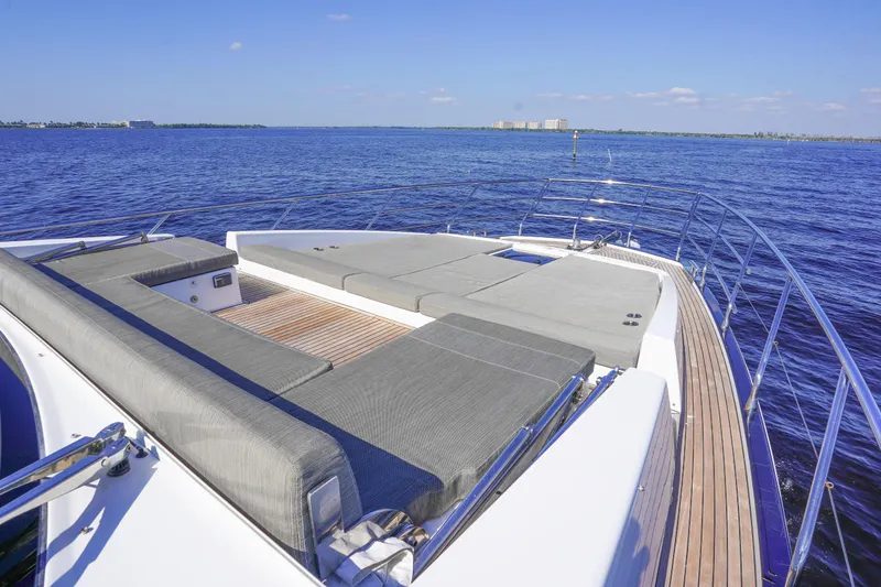 Slide: The Image of 2017 Azimut 66 Flybridge yacht with spacious sun deck on calm blue waters. - 15