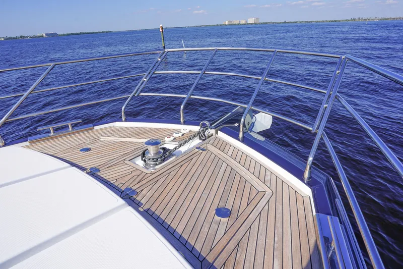 Slide: The Image of Bow view of 2017 Azimut 66 Flybridge yacht with teak deck on open water. - 18