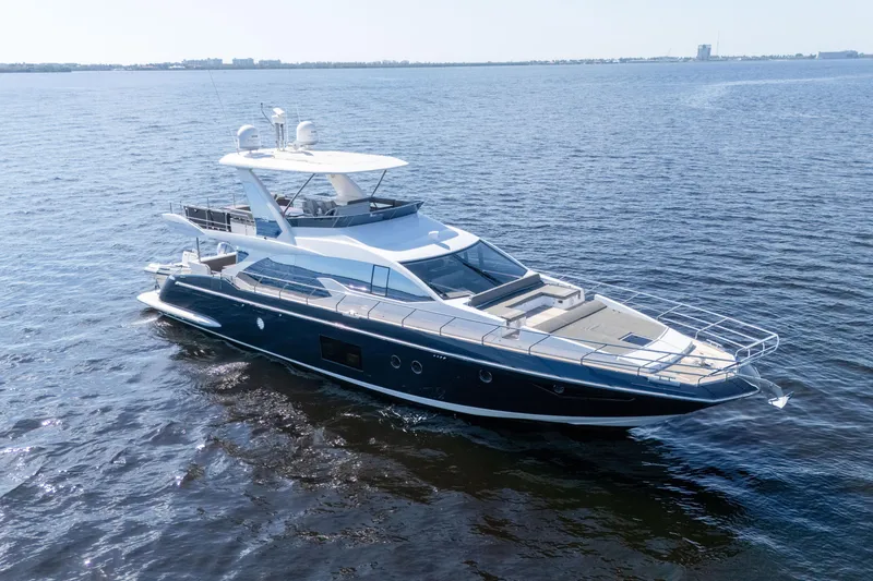 Slide: The Image of 2017 Azimut 66 Flybridge yacht cruising on open water. - 2