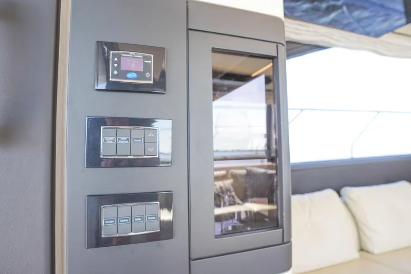 Slide: The Image of Control panel on 2017 Azimut 66 Flybridge yacht interior, featuring digital displays and buttons. - 22