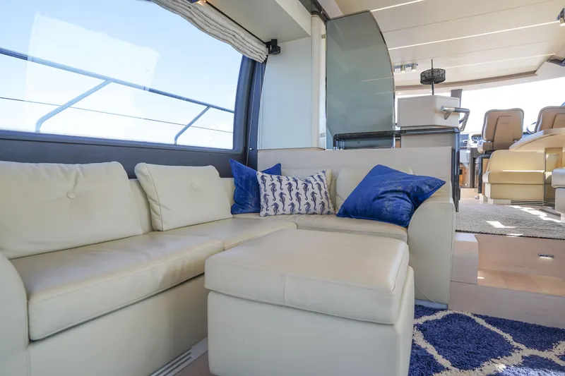 Slide: The Image of Luxurious interior of 2017 Azimut 66 Flybridge yacht with plush seating and elegant decor. - 23
