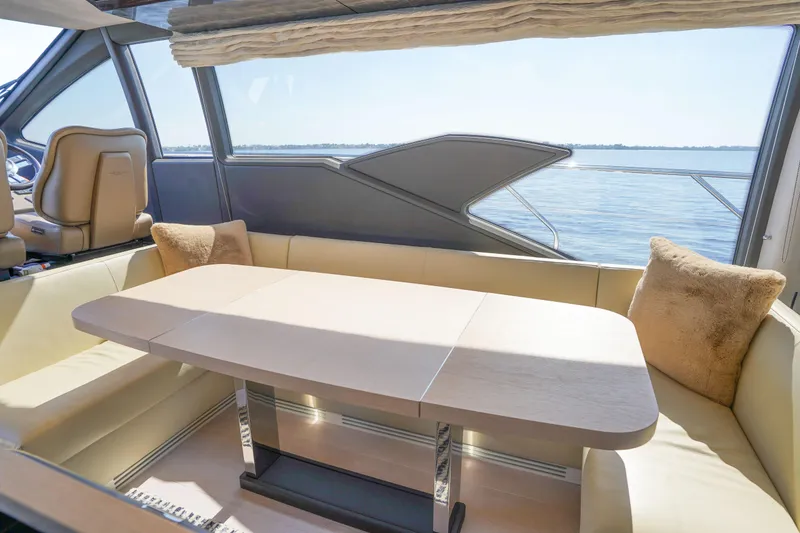 Slide: The Image of Luxurious interior of 2017 Azimut 66 Flybridge yacht with elegant seating and table. - 28